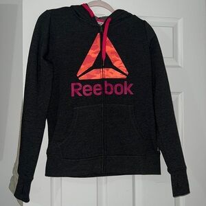 Reebok jacket new without tags. Gray pink hoodie jacket w zipper and hand hole